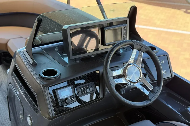 Slide: The Image of Steering console of 2026 Bennington 22 M Quad Bench boat with modern controls and displays. - 8