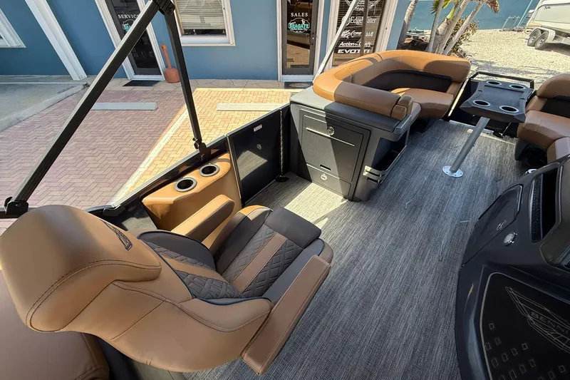 Slide: The Image of Luxurious interior of 2026 Bennington 22 M Quad Bench pontoon boat with plush seating. - 9