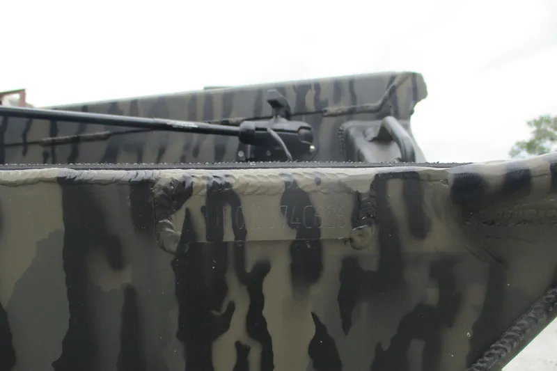 Slide: The Image of Close-up of 2026 Gator Tail 1854 Extreme boat with camouflage pattern. - 10