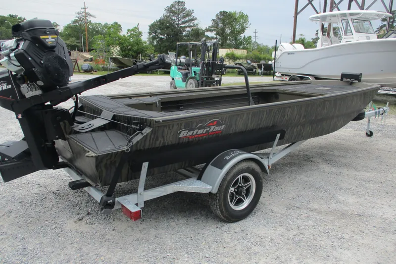Slide: The Image of 2026 Gator Tail 1854 Extreme boat on trailer, parked outdoors. - 2