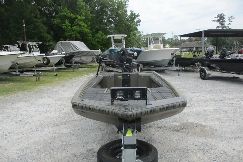 Slide: The Image of 2026 Gator Tail 1854 Extreme boat on trailer in outdoor storage area. - 6