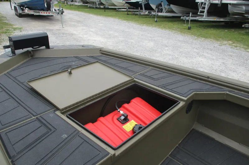Slide: The Image of 2026 Gator Tail 1854 Extreme boat with open storage compartment and red fuel tank. - 8