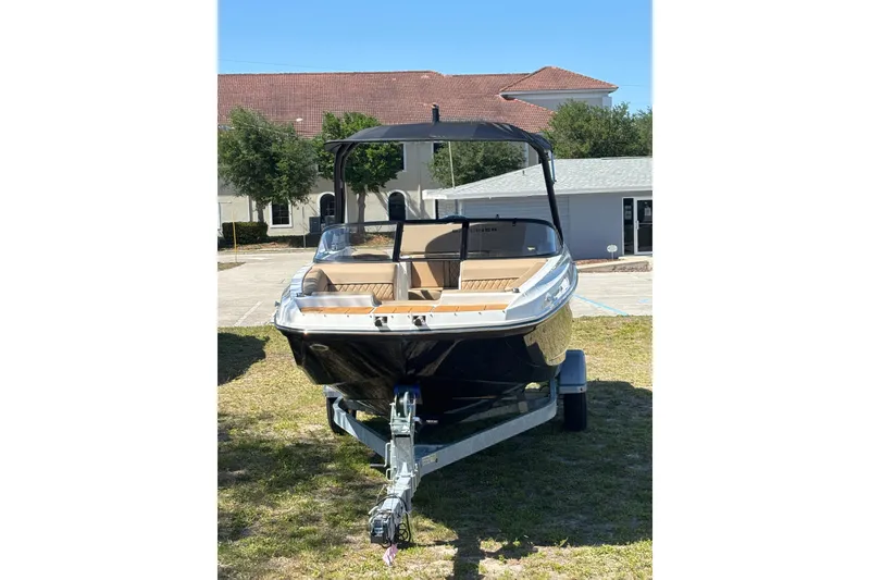 Slide: The Image of 2026 Bayliner D20 boat on trailer, parked outdoors, front view. - 4