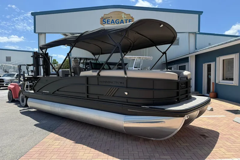 The Image of 2026 Bennington 22 M Swingback pontoon boat displayed outside dealership. - 0