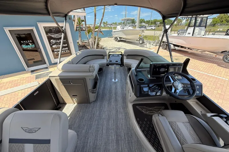 Slide: The Image of 2026 Bennington 22 M Swingback pontoon boat interior with modern helm and seating. - 11