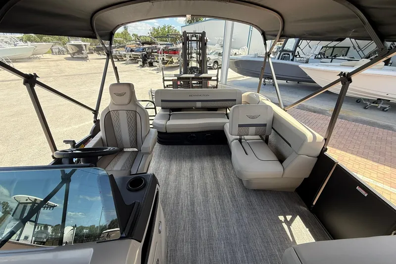 Slide: The Image of 2026 Bennington 22 M Swingback pontoon boat interior with luxurious seating and helm. - 16