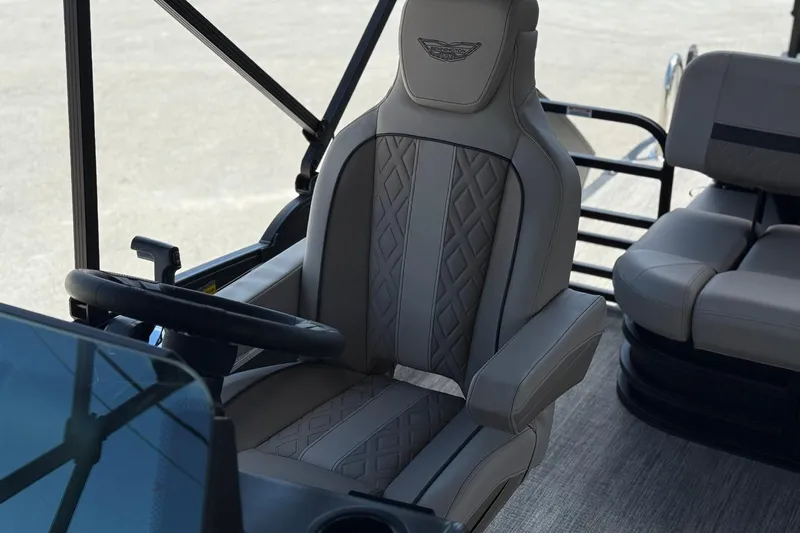 Slide: The Image of Captain's chair in 2026 Bennington 22 M Swingback pontoon boat, featuring luxurious design and comfort. - 17