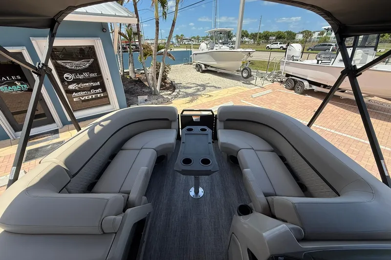 Slide: The Image of 2026 Bennington 22 M Swingback pontoon boat with spacious seating and modern design. - 18