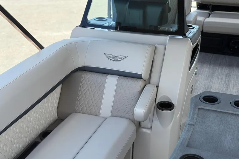 Slide: The Image of Luxurious seating on 2026 Bennington 22 M Swingback pontoon boat with cup holders and elegant design. - 20