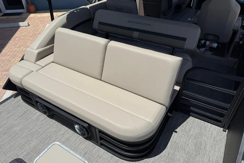 Slide: The Image of 2026 Bennington 22 M Swingback boat interior with beige seating and modern design. - 7