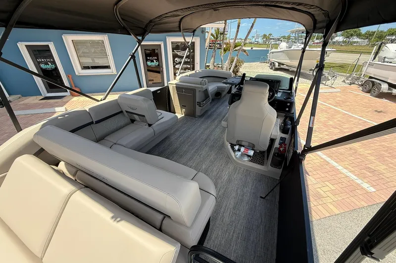 Slide: The Image of 2026 Bennington 22 M Swingback pontoon boat interior with spacious seating and modern helm. - 8