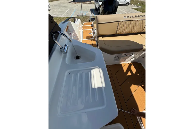Slide: The Image of 2026 Bayliner D22 boat interior with sink and seating area. - 14