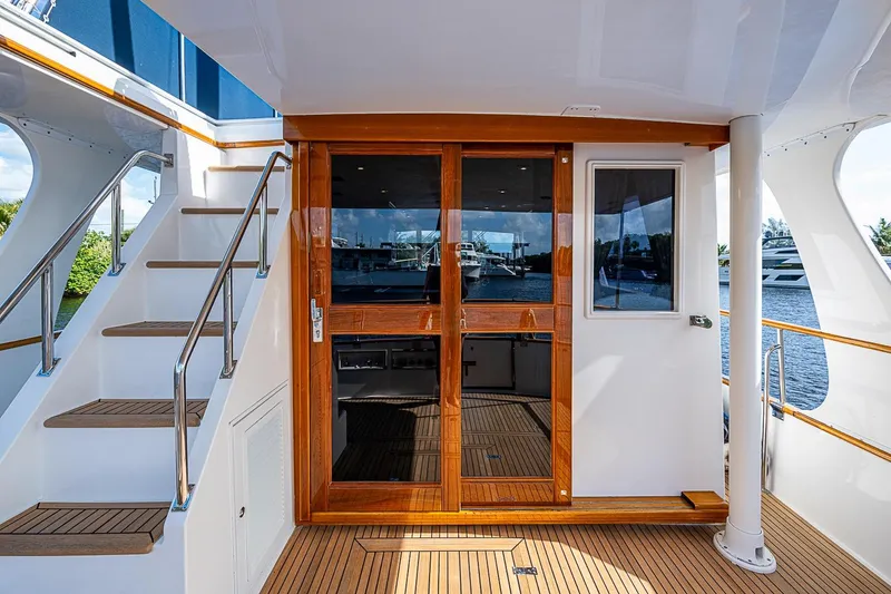 Slide: The Image of Grand Banks 42 Europa 2002 yacht with wooden doors and exterior stairs. - 11