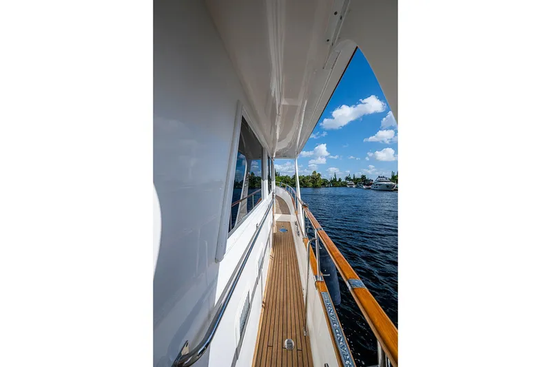 Slide: The Image of Side deck view of 2002 Grand Banks 42 Europa yacht on a sunny day. - 15