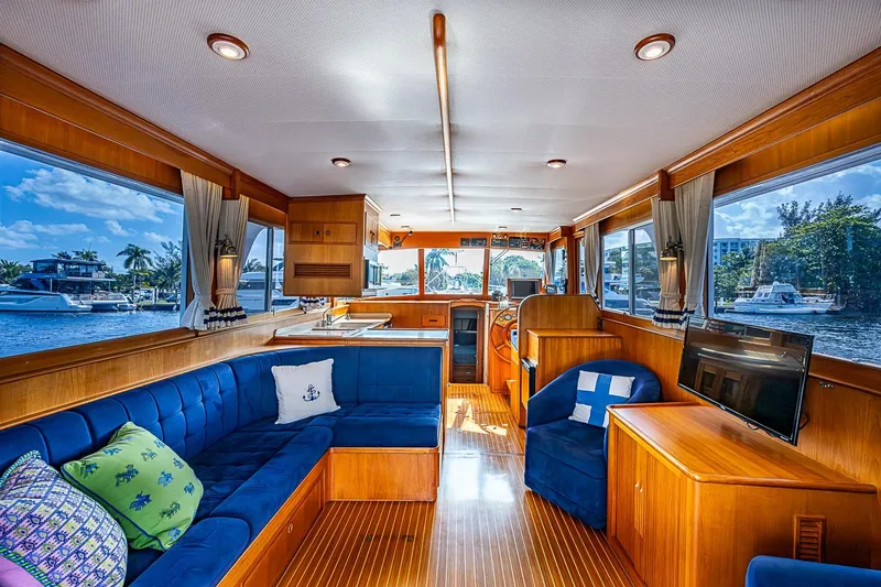 Slide: The Image of Luxurious interior of 2002 Grand Banks 42 Europa yacht with elegant wood finish and plush seating. - 2