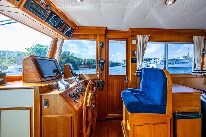 Slide: The Image of Pilothouse of 2002 Grand Banks 42 Europa yacht with wooden interior and navigation equipment. - 3