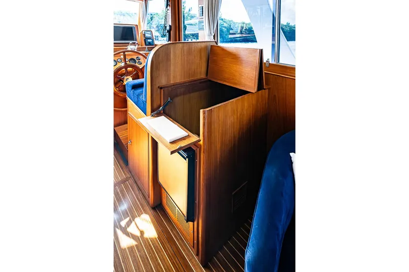 Slide: The Image of Interior of 2002 Grand Banks 42 Europa yacht with wooden cabinetry and helm station. - 32