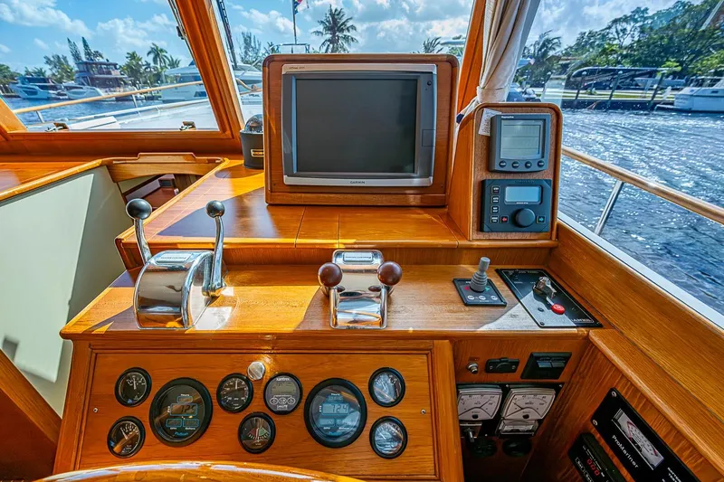 Slide: The Image of Helm of 2002 Grand Banks 42 Europa yacht with navigation instruments and controls. - 41