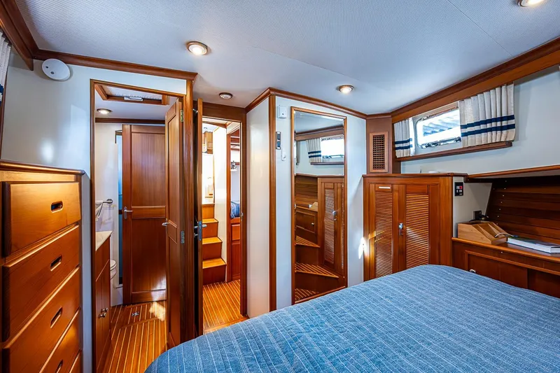 Slide: The Image of Luxurious cabin interior of 2002 Grand Banks 42 Europa yacht with wooden furnishings. - 45
