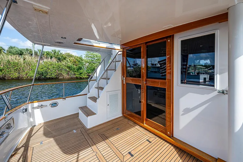 Slide: The Image of Grand Banks 42 Europa 2002 yacht deck with wooden flooring and glass doors. - 9