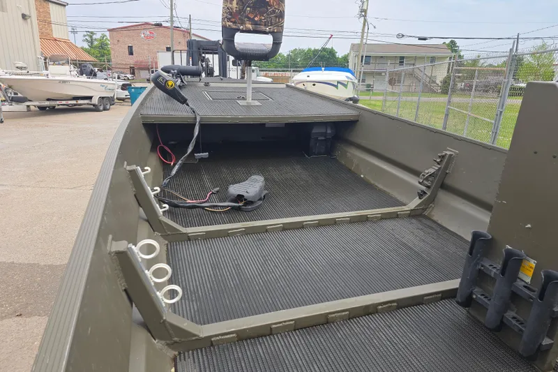 Slide: The Image of 2019 Gator Trax 18X54 boat interior with fishing rod holders and steering console. - 6