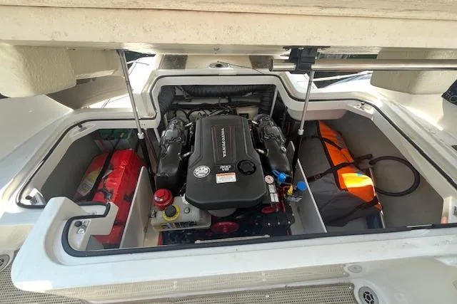 Slide: The Image of 2018 Cobalt R5 boat engine compartment with storage and safety equipment. - 23