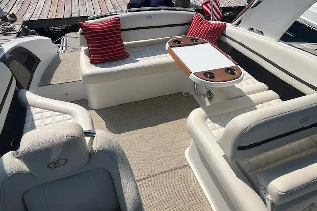 Slide: The Image of Luxurious 2018 Cobalt R5 boat interior with plush seating and elegant table setup. - 9