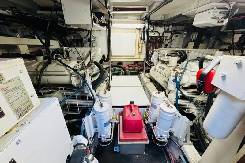 Slide: The Image of Engine room of 1991 Californian 55 Cockpit Motor Yacht, showcasing machinery and components. - 108