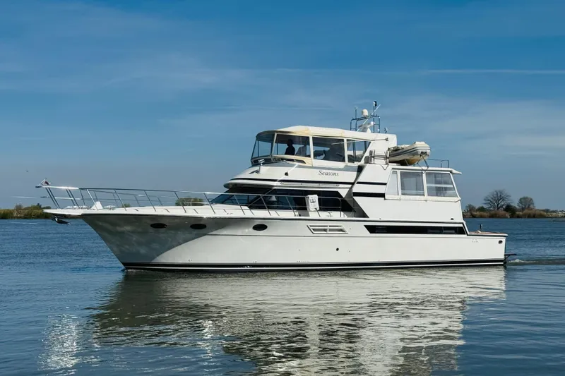 Slide: The Image of 1991 Californian 55 Cockpit Motor Yacht cruising on calm waters under clear skies. - 11