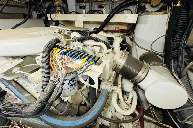 Slide: The Image of Engine room of 1991 Californian 55 Cockpit Motor Yacht with visible wiring and components. - 112
