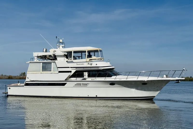 Slide: The Image of 1991 Californian 55 Cockpit Motor Yacht cruising on calm waters under clear skies. - 16