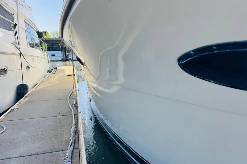 Slide: The Image of 1991 Californian 55 Cockpit Motor Yacht docked at marina, side view. - 22