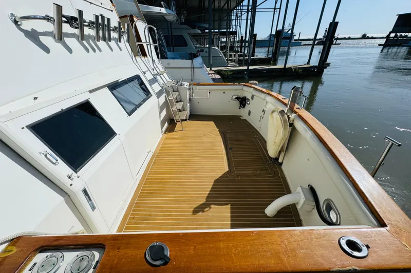 Slide: The Image of 1991 Californian 55 Cockpit Motor Yacht with spacious deck and waterfront view. - 26