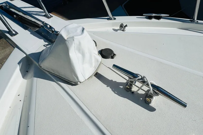 Slide: The Image of Deck of 1991 Californian 55 Cockpit Motor Yacht with cleat and covered equipment. - 31