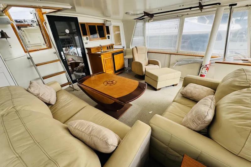 Slide: The Image of Luxurious interior of 1991 Californian 55 Cockpit Motor Yacht with plush seating and elegant decor. - 36