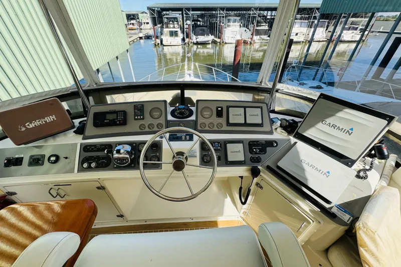 Slide: The Image of Cockpit view of 1991 Californian 55 Motor Yacht with Garmin navigation systems. - 44