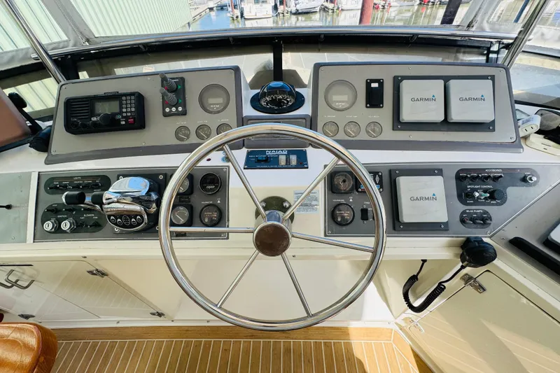 Slide: The Image of Cockpit of 1991 Californian 55 Cockpit Motor Yacht with steering wheel and navigation instruments. - 47
