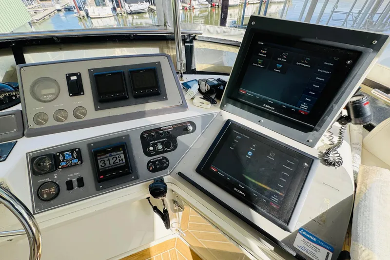 Slide: The Image of Cockpit of 1991 Californian 55 Cockpit Motor Yacht with navigation and control panels. - 48