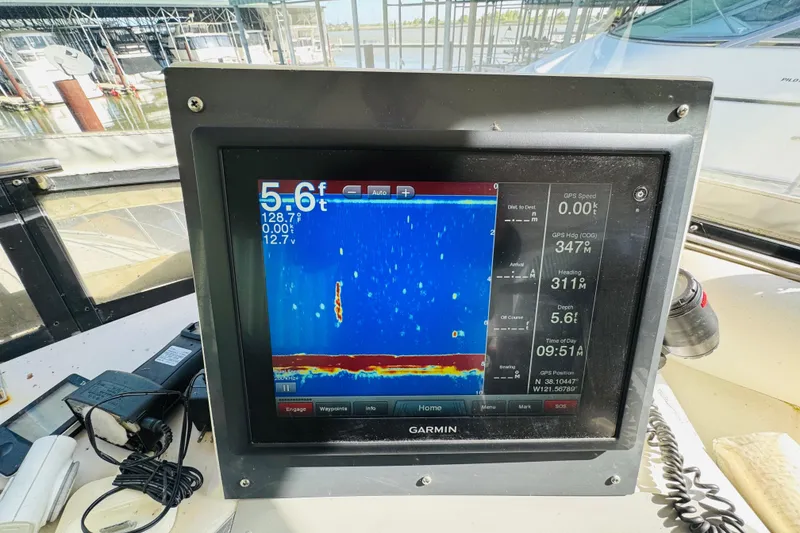 Slide: The Image of Garmin marine display on 1991 Californian 55 Cockpit Motor Yacht, showing sonar and navigation data. - 51