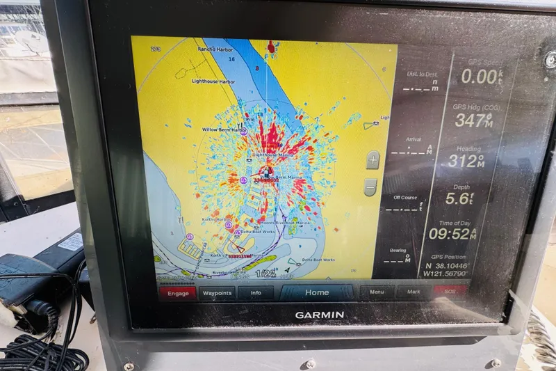 Slide: The Image of Garmin GPS display on 1991 Californian 55 Cockpit Motor Yacht, showing nautical chart and navigation data. - 52