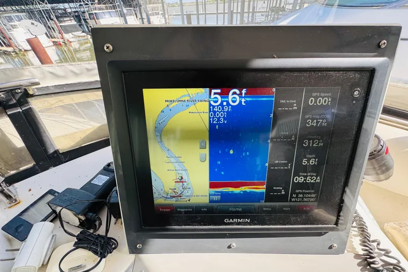 Slide: The Image of Garmin navigation display on 1991 Californian 55 Cockpit Motor Yacht, showing river map and depth. - 54