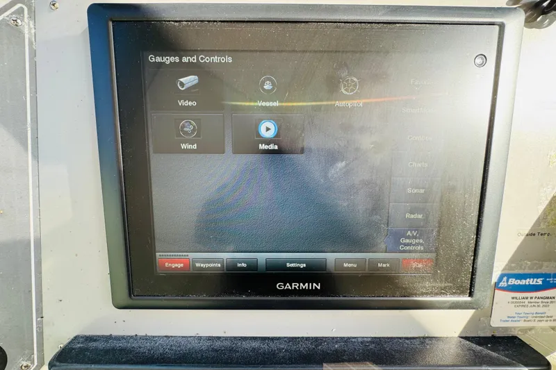 Slide: The Image of Garmin navigation display on 1991 Californian 55 Cockpit Motor Yacht showing gauges and controls. - 56