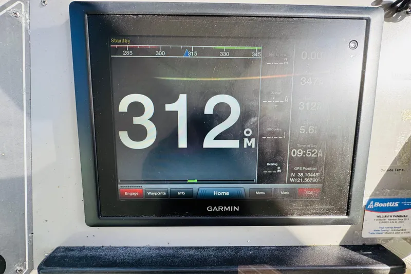 Slide: The Image of Garmin navigation display on 1991 Californian 55 Cockpit Motor Yacht showing heading of 312 degrees. - 58