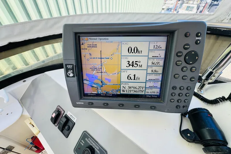 Slide: The Image of Navigation system on 1991 Californian 55 Cockpit Motor Yacht displaying map and data. - 63