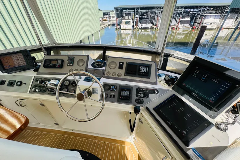 Slide: The Image of Cockpit of 1991 Californian 55 Cockpit Motor Yacht with navigation instruments and steering wheel. - 65