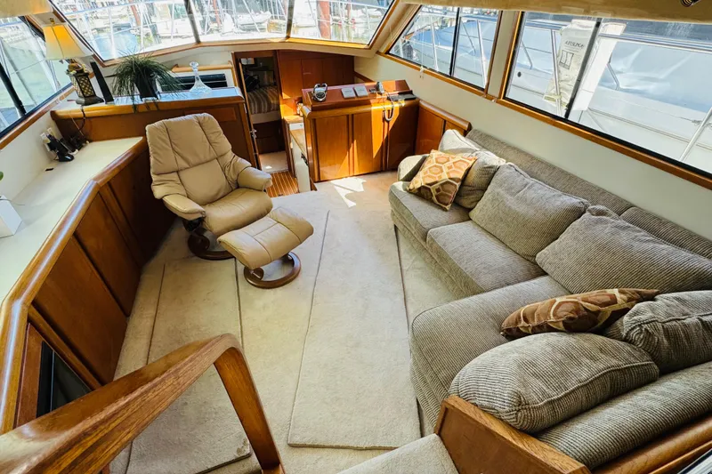 Slide: The Image of Luxurious interior of 1991 Californian 55 Cockpit Motor Yacht with plush seating and elegant decor. - 68
