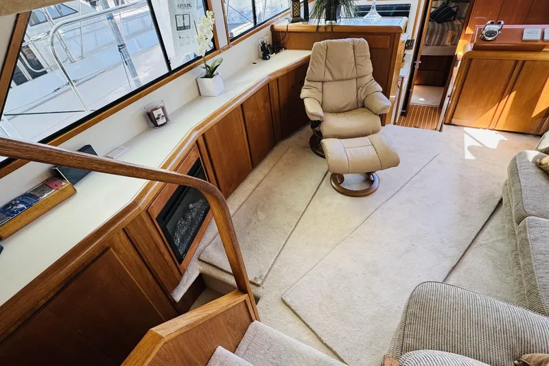 Slide: The Image of Luxurious interior of a 1991 Californian 55 Cockpit Motor Yacht with plush seating and elegant decor. - 69