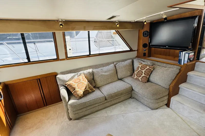 Slide: The Image of Luxurious interior of 1991 Californian 55 Cockpit Motor Yacht with cozy seating and TV. - 72