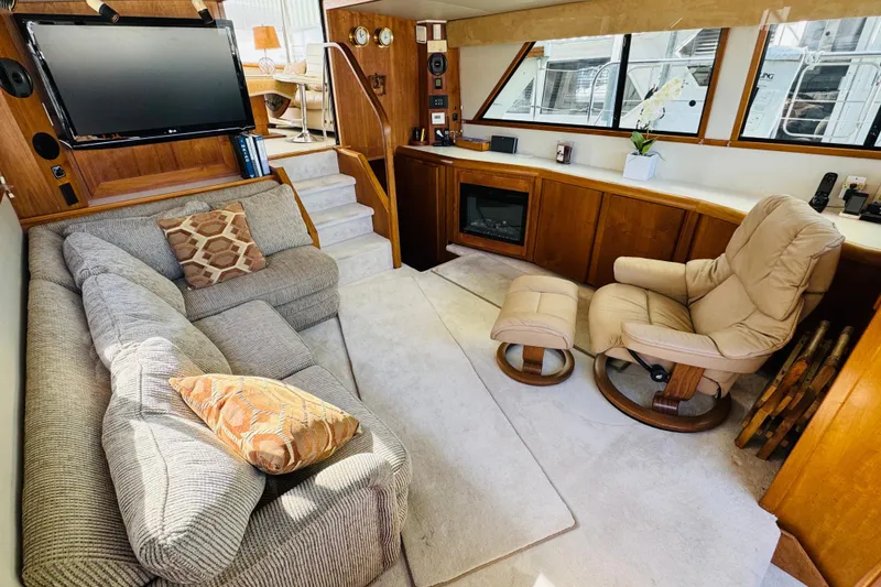 Slide: The Image of Luxurious interior of 1991 Californian 55 Cockpit Motor Yacht with cozy seating and modern amenities. - 74