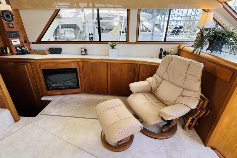 Slide: The Image of Luxurious interior of a 1991 Californian 55 Cockpit Motor Yacht with plush seating and elegant decor. - 75
